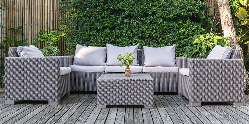 Private garden lounge area with bamboo privacy screens